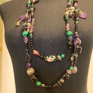 Bohemian style long double stranded necklace in black, silver, purple and green.